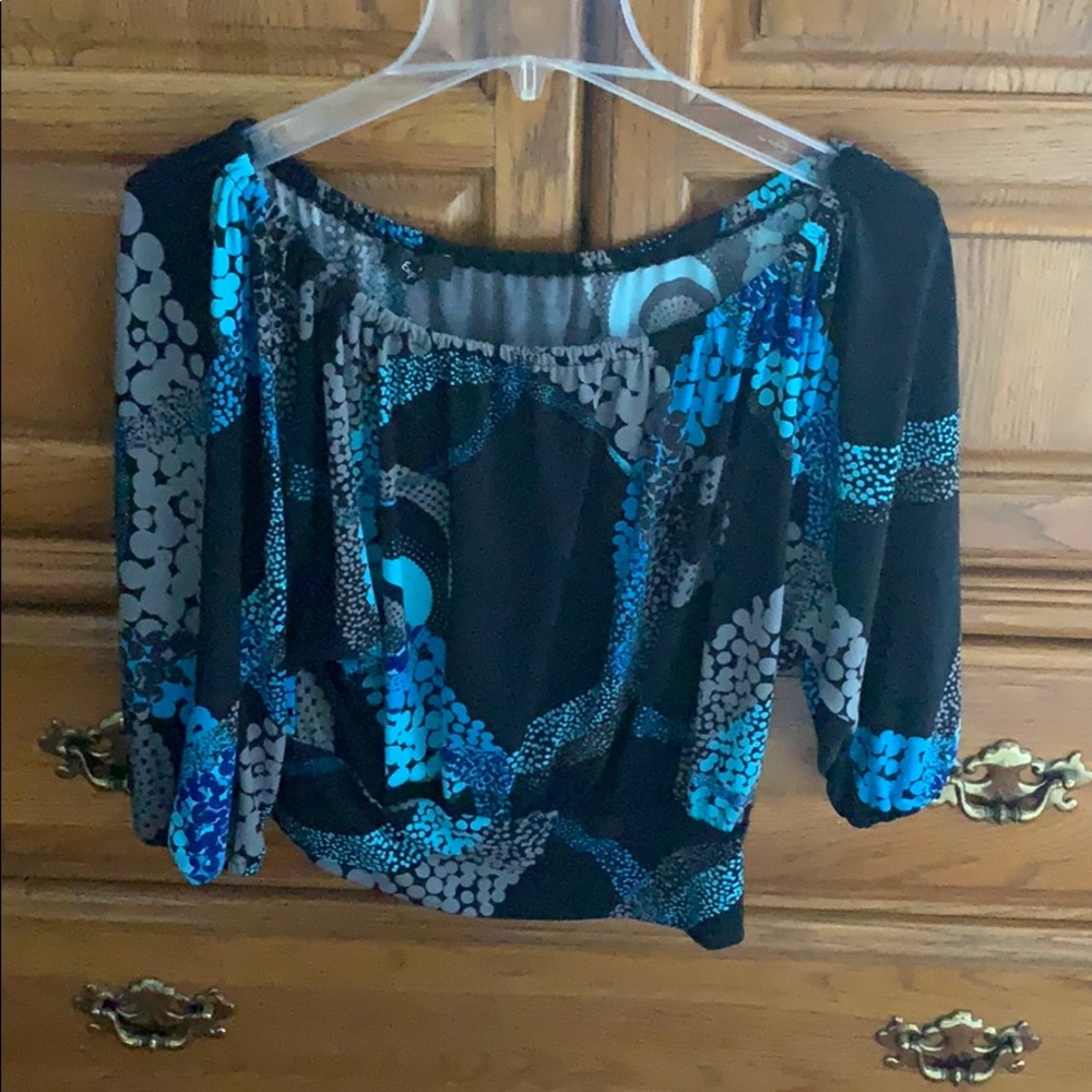 Quarter sleeve off the shoulder shirt